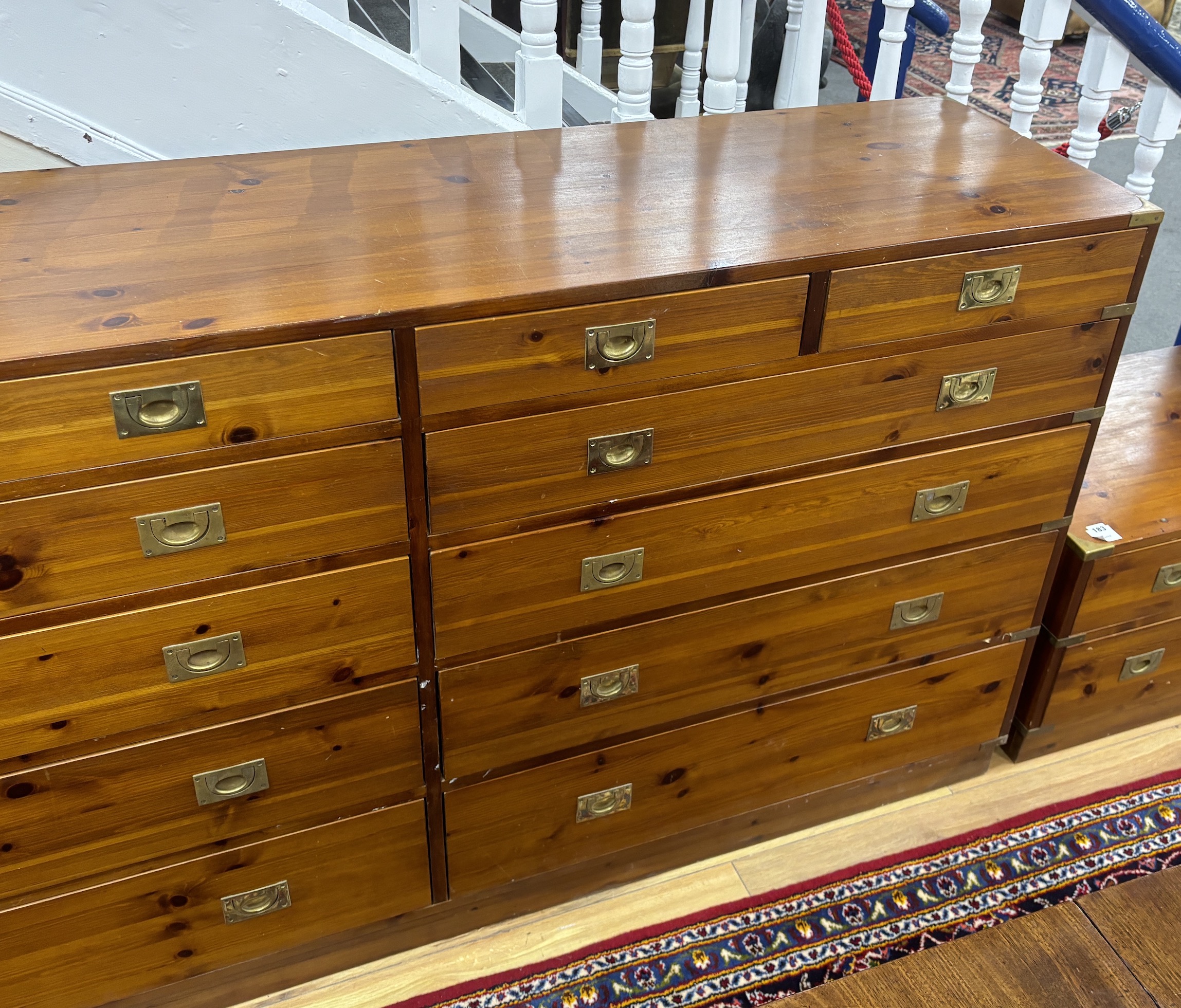 A large military style brass mounted pine twelve drawer chest, width 183cm, depth 46cm, height 97cm